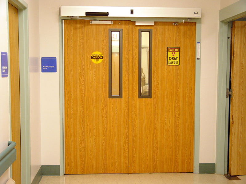 Lead-lined P/Lam equal pair · automatic openers, narrow lead-glass view lites
