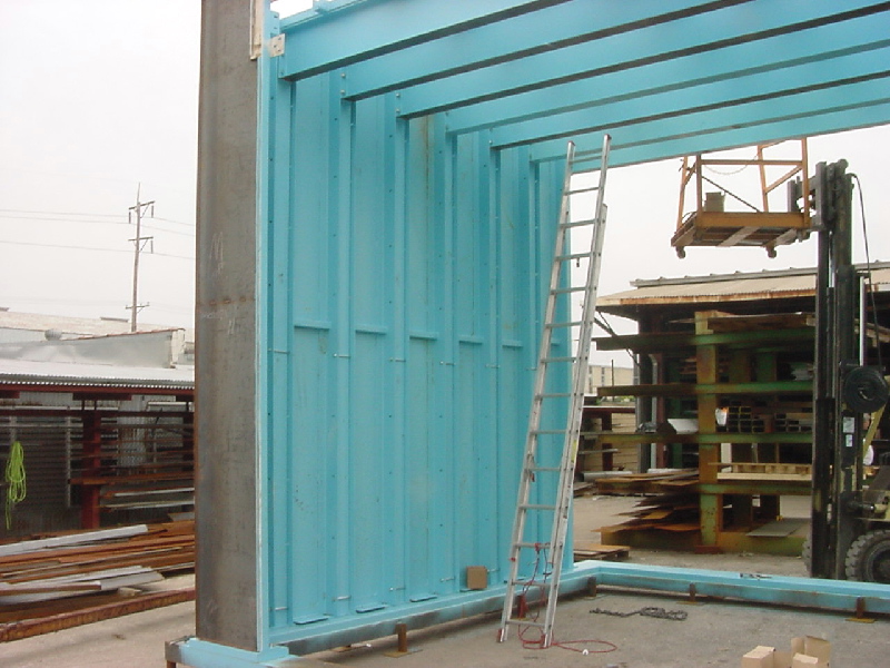 A-fabco crew assembling an NDT enclosure at an aerospace plant